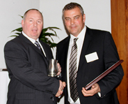 John McGhin, who has been with Chirmarn for 17 years, being presented with the award
